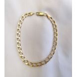 NINE CARAT GOLD CURB LINK BRACELET 22.2cm long and approximately 8.