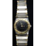 LADIES OMEGA CONSTELLATION BI-METAL WRISTWATCH the black dial with button five minute markers and