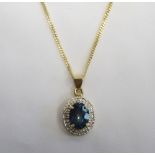 MYSTIC TOPAZ AND DIAMOND CLUSTER PENDANT the central topaz in diamond set surround,