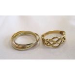 TWO GOLD RINGS one a three tone fourteen carat gold interlocking Russian wedding ring,