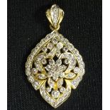 IMPRESSIVE DIAMOND SET PENDANT the multi diamonds in intricate pierced setting,