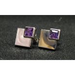 PAIR OF AMETHYST SET NINE CARAT WHITE GOLD EARRINGS each formed with two graduated interlocking