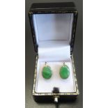 PAIR OF JADE EARRINGS in fourteen carat gold with screw fastenings