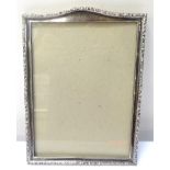 EARLY GEORGE V SILVER PHOTOGRAPH FRAME with embossed scroll border, H.Matthews Birmingham 1913, 24.