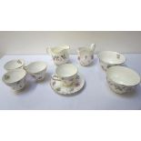 TUSCAN 'WINDSWEPT' BONE CHINA TEA SERVICE the design of variant form, comprising six cups,