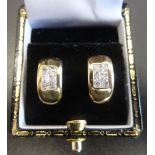 PAIR OF CZ SET NINE CARAT GOLD EARRINGS of curved form