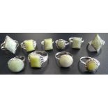 TEN SILVER RINGS all set with green marble and some with marcasite