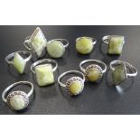 TEN SILVER RINGS all set with green marble and some with marcasite