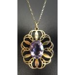 IONA AMETHYST SET NINE CARAT GOLD PENDANT by John Hart,