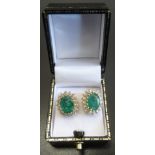 PAIR OF EMERALD AND DIAMOND CLUSTER STUD EARRINGS each of the emeralds approximately 2cts and in