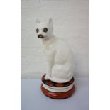 LARGE PAINTED POTTERY CAT white with facial details, in upright seated position,