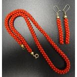 CORAL BEAD NECKLACE with silver gilt clip, the beads 49.