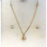 DIAMOND SET PENDANT AND PAIR OF EARRINGS all in fourteen carat gold and the pendant on fourteen