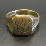 NINE CARAT GOLD SIGNET RING with engraved initials 'CG', ring size W, approximately 7.