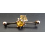 EDWARDIAN CITRINE SET BAR BROOCH the bar with central heart cut citrine surmounted by a crown,