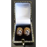 PAIR OF NINE CARAT GOLD EARRINGS of pierced foliate design in white and yellow gold