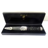 SILVER MOUNTED SGIAN DUBH the celtic carved ebony handle set with a hard stone and leather sheath,