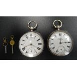 TWO VICTORIAN SILVER CASED POCKET WATCHES both with black Roman numerals and subsidiary dials on