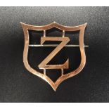 SCOTTISH OLYMPIC INTEREST a nine carat gold brooch modelled with the letter 'Z' within a shield,