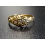 GRADUATED DIAMOND FIVE STONE RING in pierced and scroll setting, on eighteen carat gold shank,