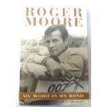 ROGER MOORE SIGNED 'MY WORD IS MY BOND' hardback book,