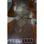 NORTH AFRICAN EMBROIDERED SHAWL with folded metalwork detail in geometric design and camel train