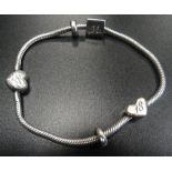 CLOGAU CARIAD MILESTONES SILVER BRACELET in silver with gold detail to heart shaped clasp,