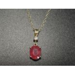 RUBY AND DIAMOND PENDANT the oval cut ruby approximately 3cts below a round brilliant cut diamond