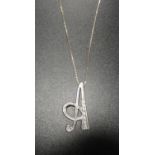 DIAMOND SET EIGHTEEN CARAT WHITE GOLD PENDANT in the form of an italic A,