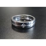 EIGHTEEN CARAT WHITE GOLD WEDDING BAND set with flush CZ stone,