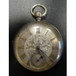 VICTORIAN SILVER CASED POCKET WATCH with Roman numerals laid on a silvered dial with engraved