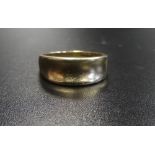 NINE CARAT GOLD WEDDING BAND with concave design to the front section,