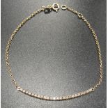 DIAMOND SET EIGHTEEN CARAT GOLD BRACELET the central line of twenty-four diamonds flanked by chain