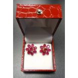 PAIR OF RUBY CLUSTER STUD EARRINGS the floral design earrings with central round cut ruby