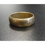 NINE CARAT GOLD WEDDING BAND with decorative hallmarks to the band exterior,