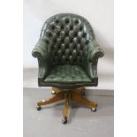 ***WITHDRAWN*** A GEORGIAN STYLE GREEN LEATHER UPHOLSTERED TUB SHAPED OFFICE CHAIR,