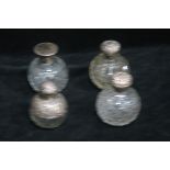 FOUR VICTORIAN CUT GLASS SILVER MOUNTED DRESSING TABLE BOTTLES,