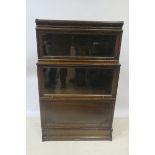 A 20th CENTURY OAK FRAMED DISPLAY CABINET,