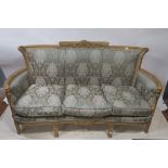 A CONTINENTAL GILTWOOD AND PAINTED SOFA,