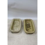 A PAIR OF COMPOSITION STONE TROUGHS,