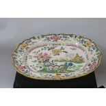 AN IRONSTONE CHINA MEAT PLATTER, the white ground decorated with pagodas,