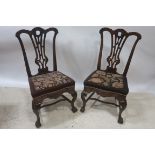 A SUITE OF EIGHT CHIPPENDALE STYLE MAHOGANY CARVED DINING ROOM CHAIRS,