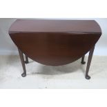 A FINE GEORGIAN MAHOGANY DROP LEAF TABLE the oval top raised on cabriole legs with pad feet