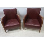 A PAIR OF MID 20th CENTURY RED LEATHER UPHOLSTERED ARMCHAIRS,