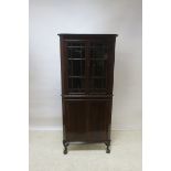 A MAHOGANY CORNER CABINET, with astragal glazed doors and gadrooned carving,