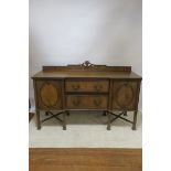 A GEORGIAN REVIVAL BREAKFRONT SIDEBOARD, with raised gallery and rope twist rims,