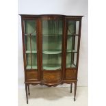 AN EDWARDIAN MAHOGANY AND MARQUETRY INLAID DISPLAY CABINET, with bowed centre section,