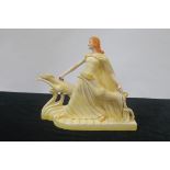 AN ART DECO FIGURE, modelled as Diana the Huntress with hounds,