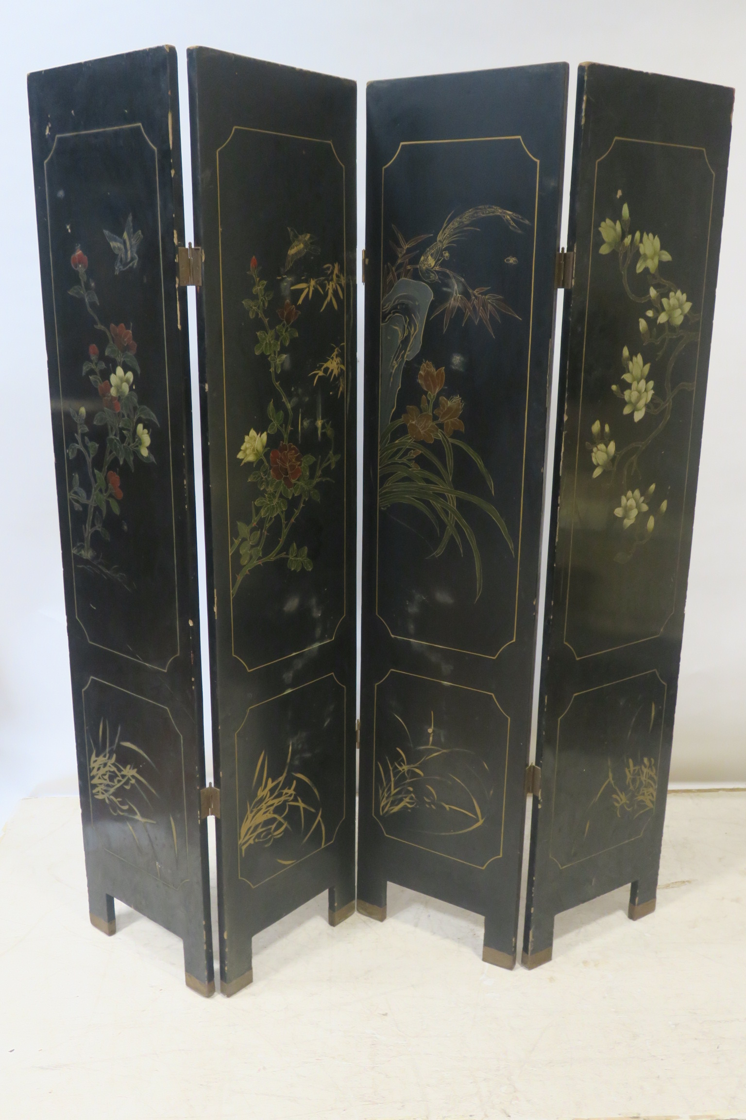 AN ORIENTAL FOUR FOLD EBONISED ROOM SCREEN,