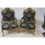 A PAIR OF CARVED GILTWOOD ARMCHAIRS, in Louis Seize style, of large proportions,